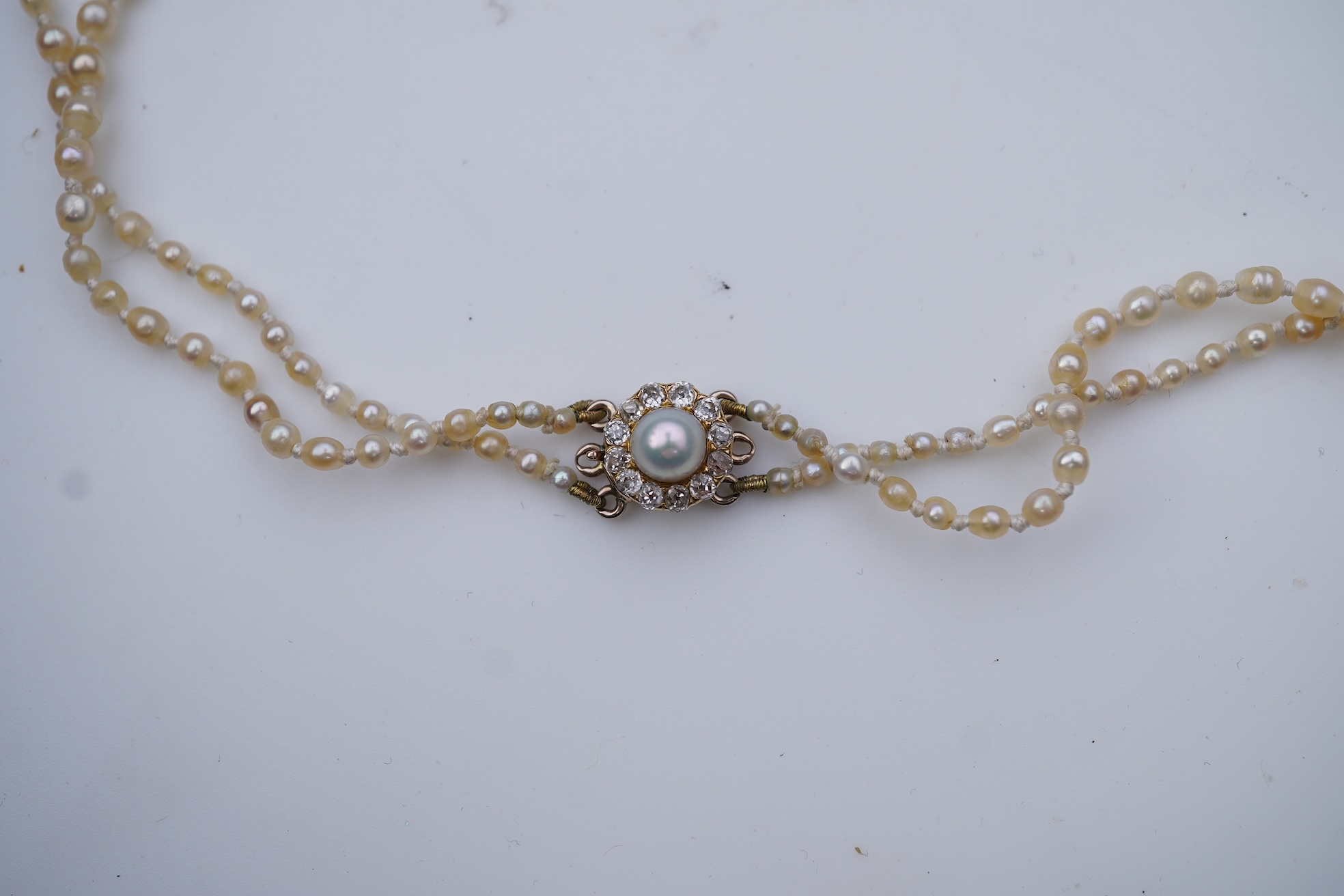 A natural pearl and diamond necklace, early 20th century